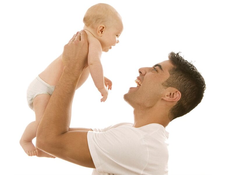 Man Holding Baby — White, Joyful