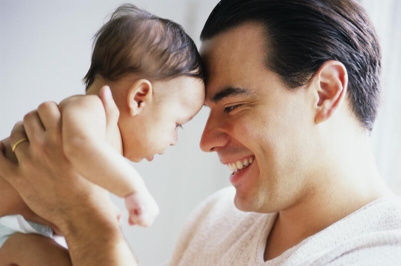 Man Holding Baby — White