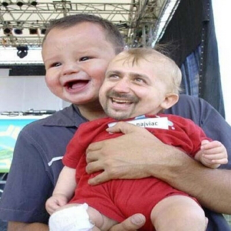 man holding baby with swapped faces