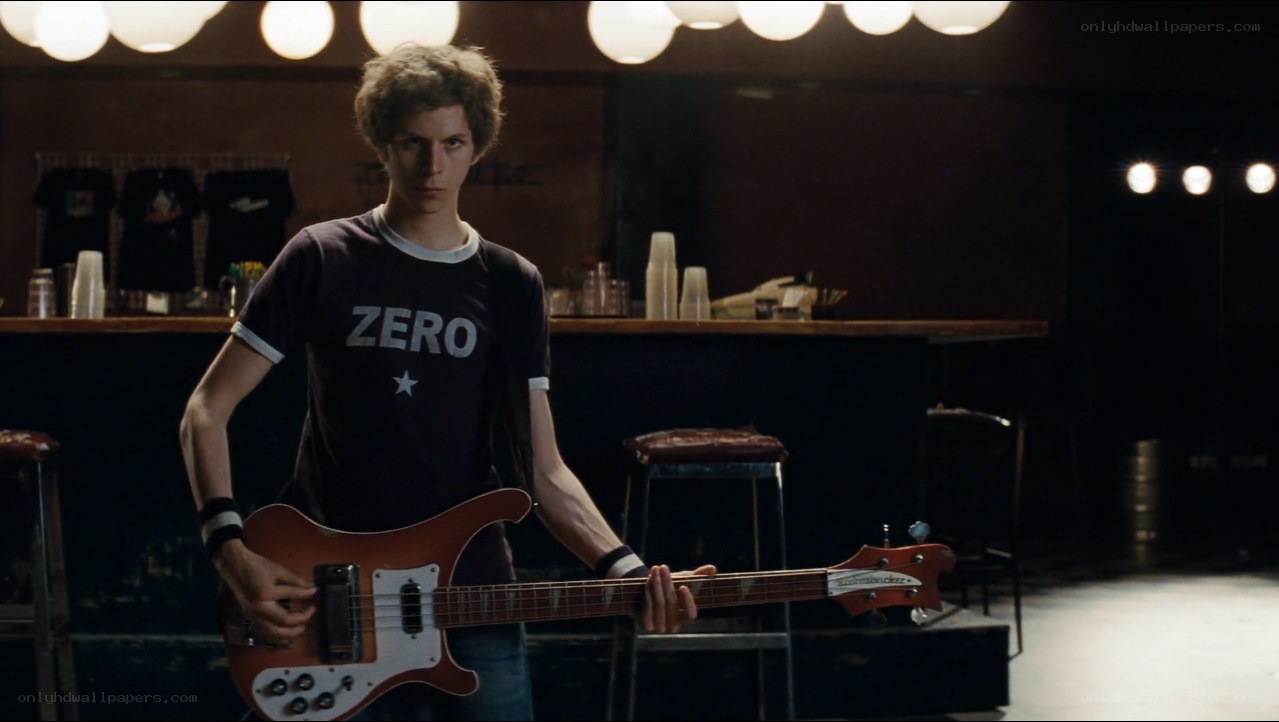man holding bass guitar