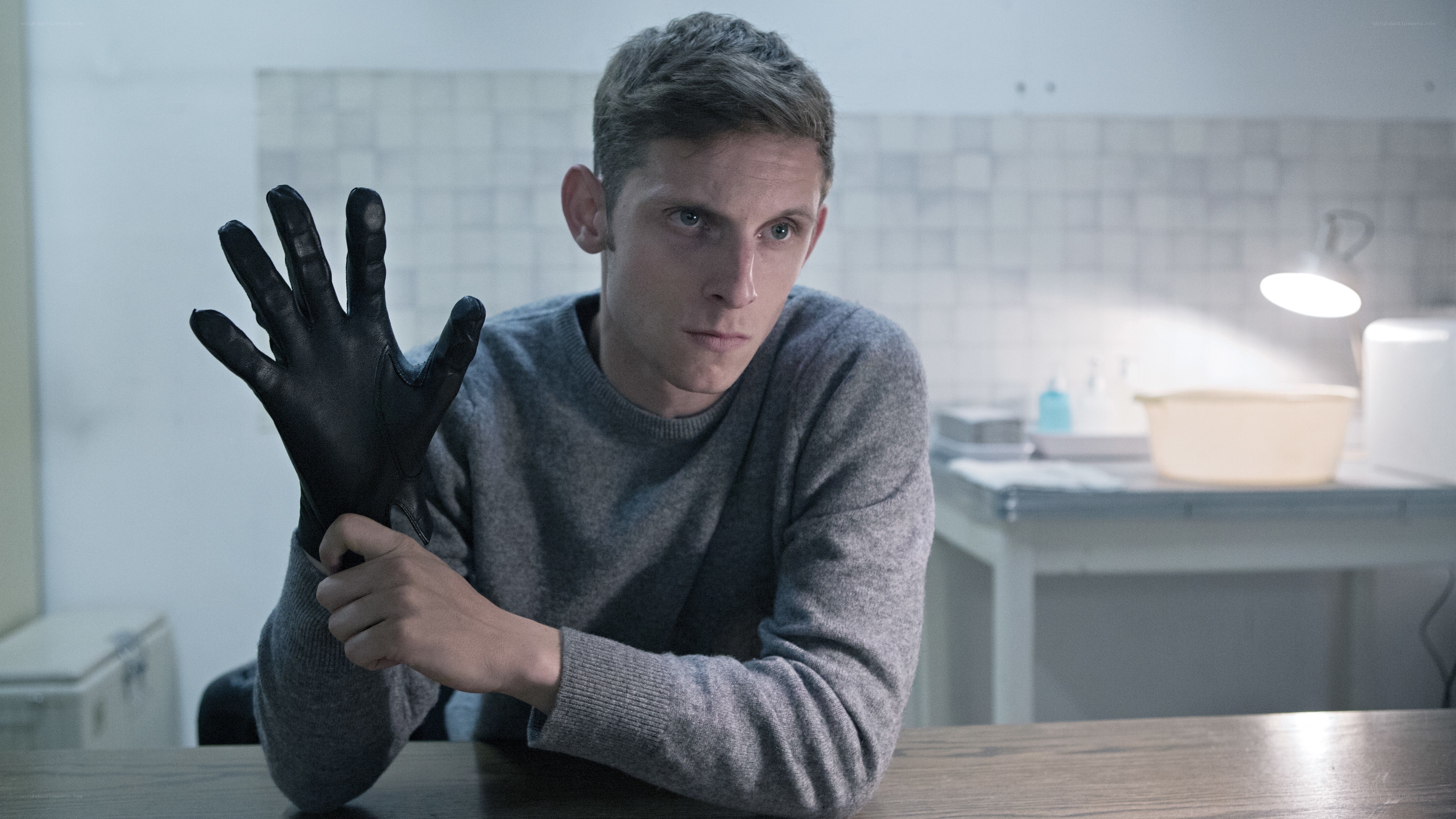 man holding black glove