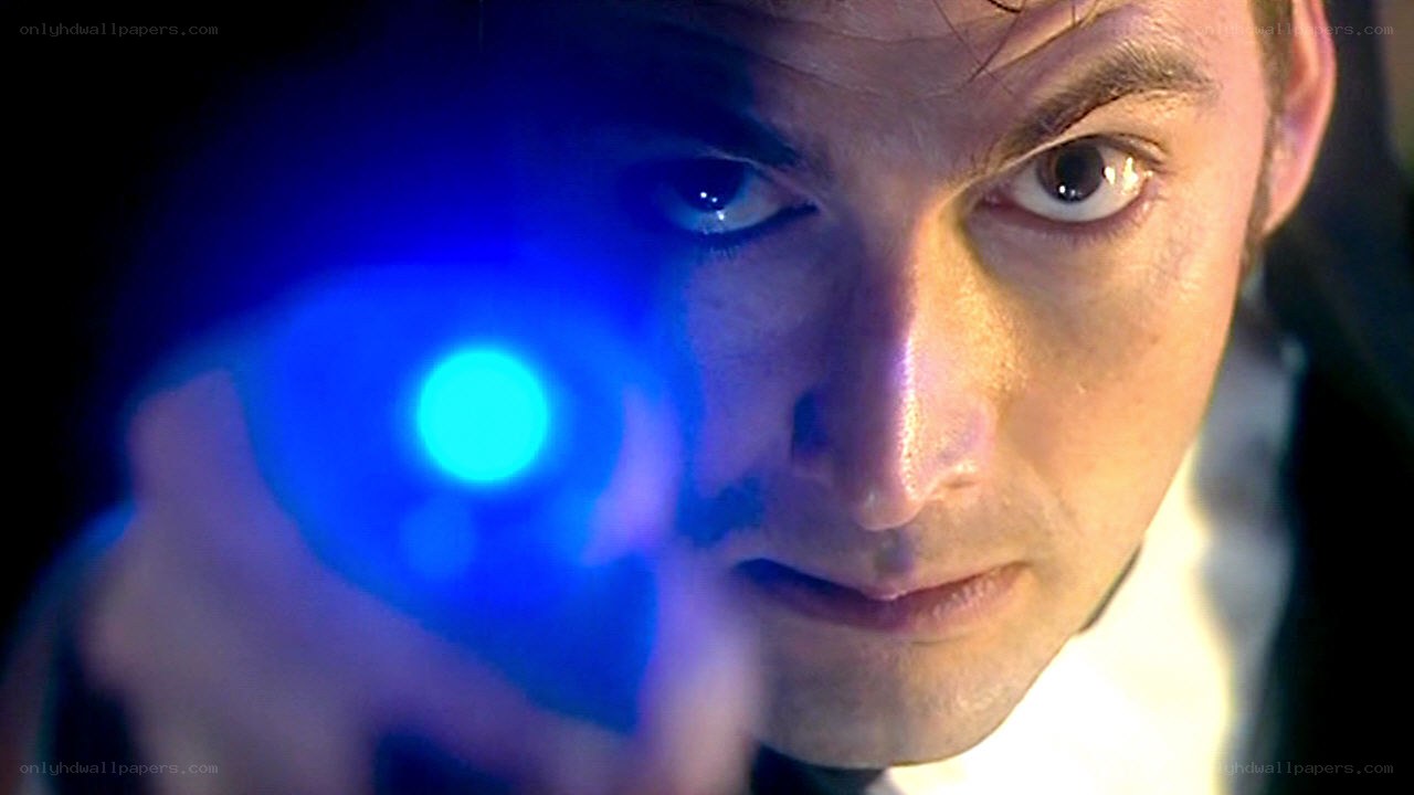 man holding blue light device
