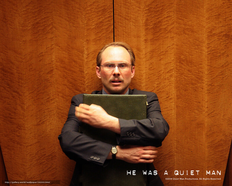 man holding book in elevator