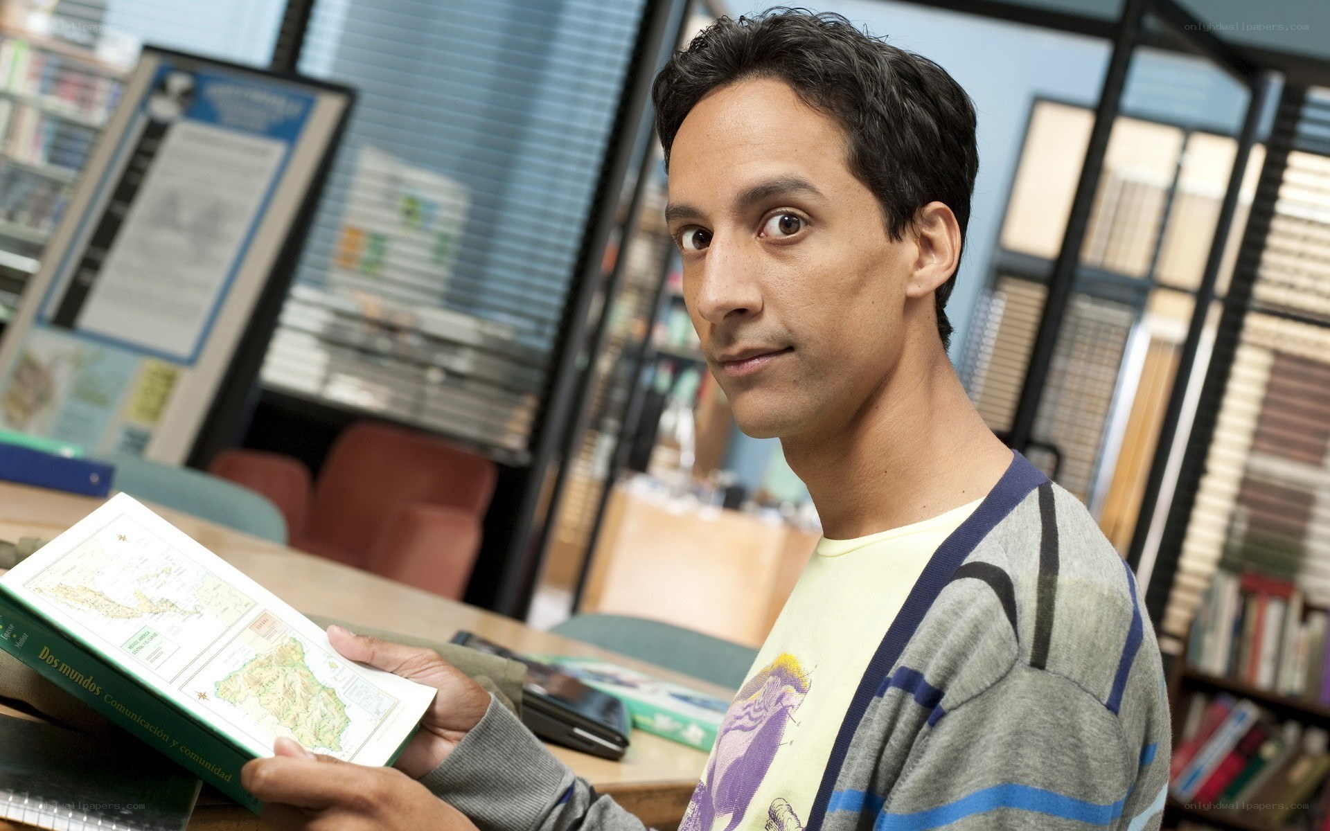 man holding book in library
