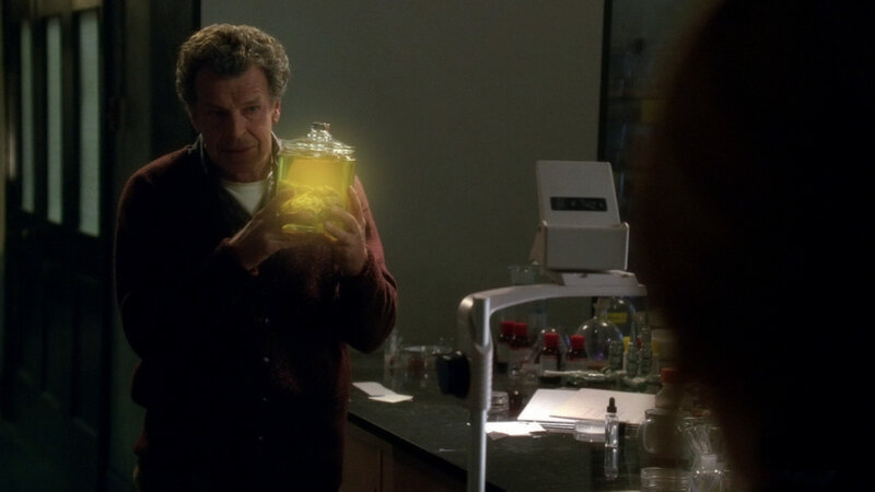 Man holding brain in jar