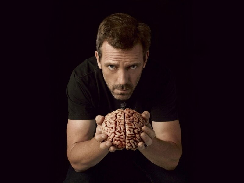 Man Holding Brain Model — Black, Dramatic