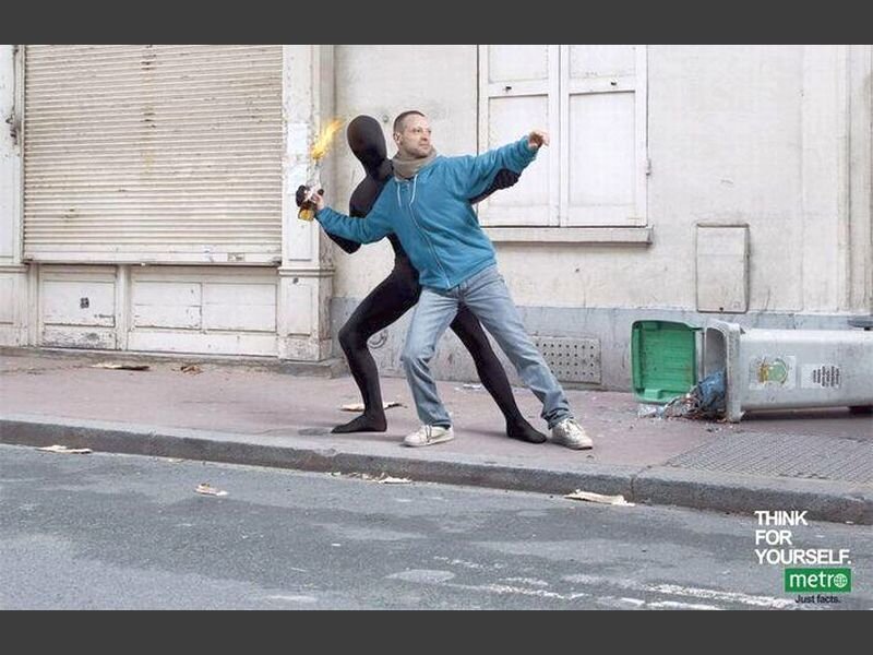 Man Holding Burning Object
