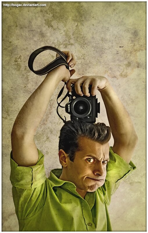 man holding camera above head