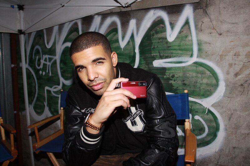 Man Holding Camera — Black, Casual