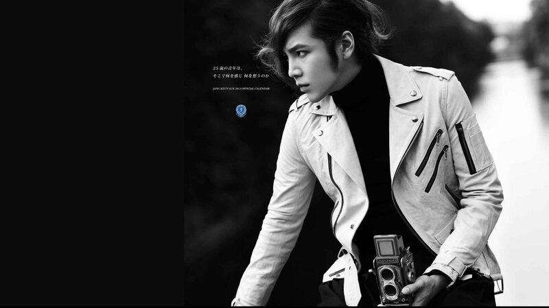 Man Holding Camera — Black, Dramatic, Photograph, Jacket