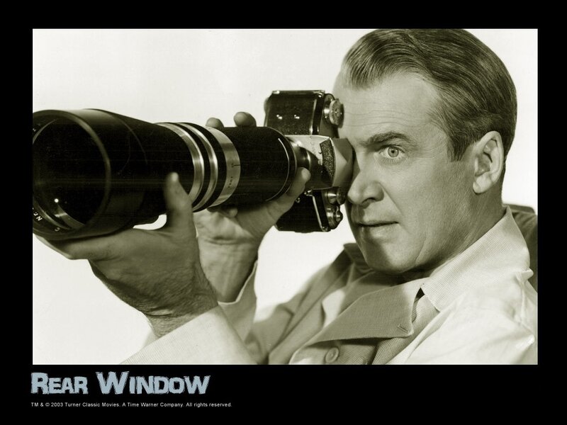 Man Holding Camera — Black, Dramatic, Photograph, Shirt