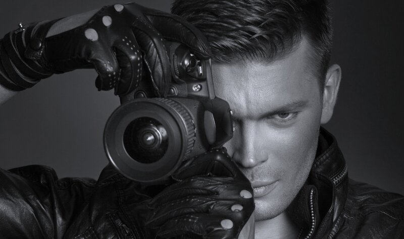 Man Holding Camera — Black, Dramatic, Photograph