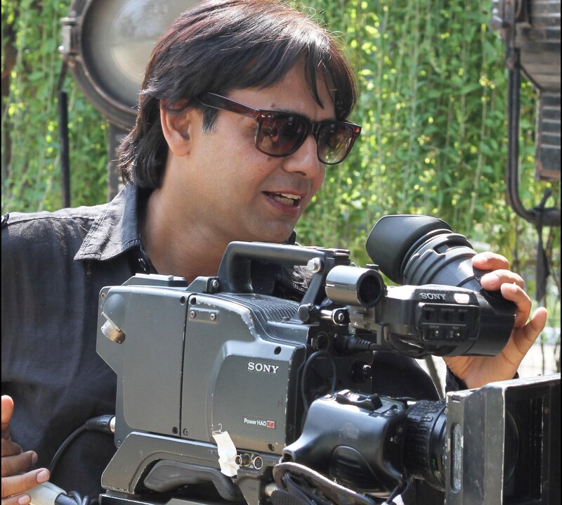 Man Holding Camera — Black, Focused