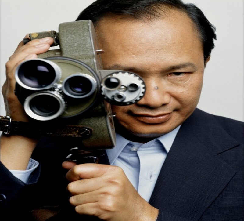 Man Holding Camera — Black, Serious