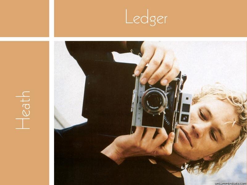 Man Holding Camera — Brown, Calm