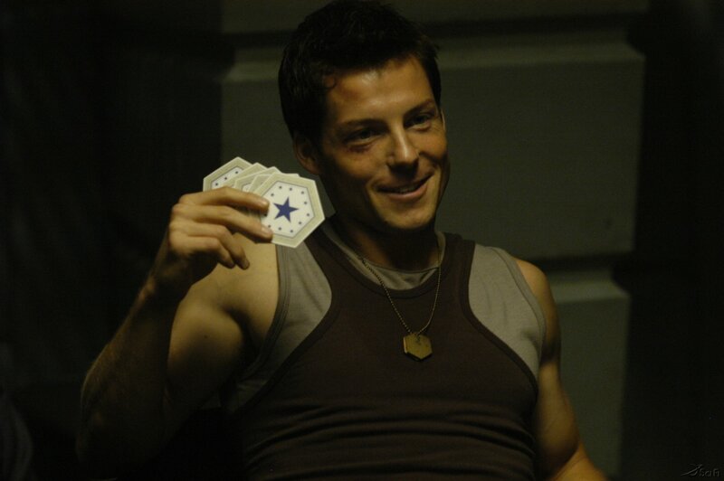 man holding cards in dark room