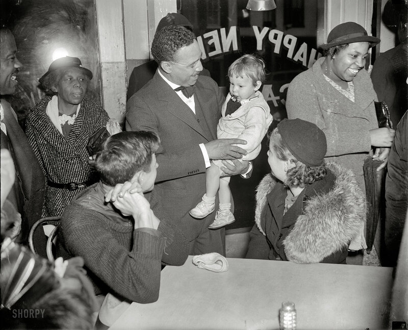 Man holding child in crowd