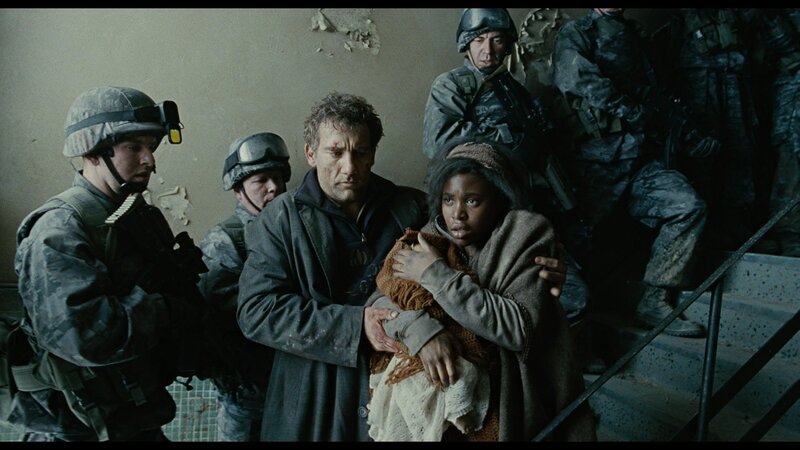 Man Holding Child in Rubble