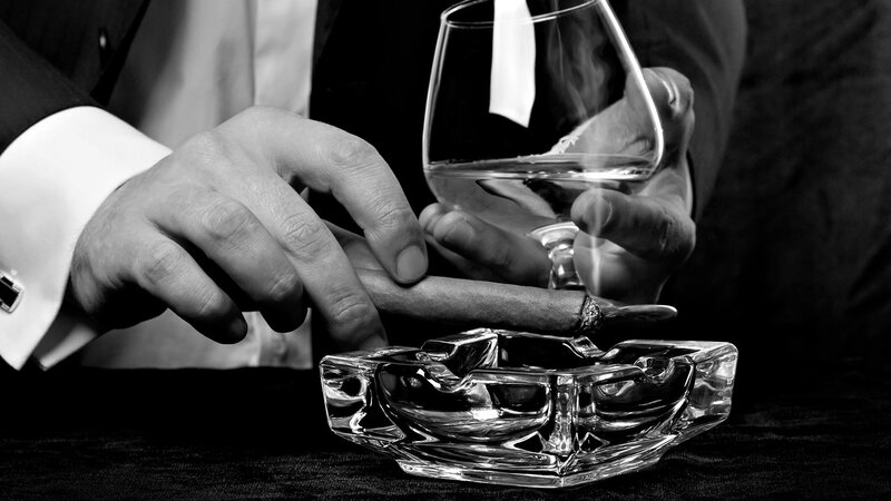 Man Holding Cigar and Glass