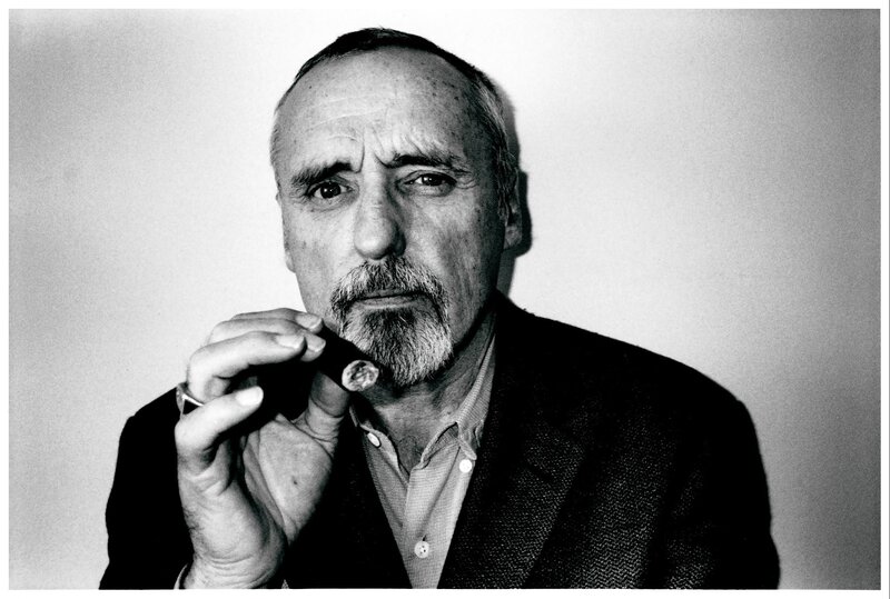 Man Holding Cigar — Black, Serious