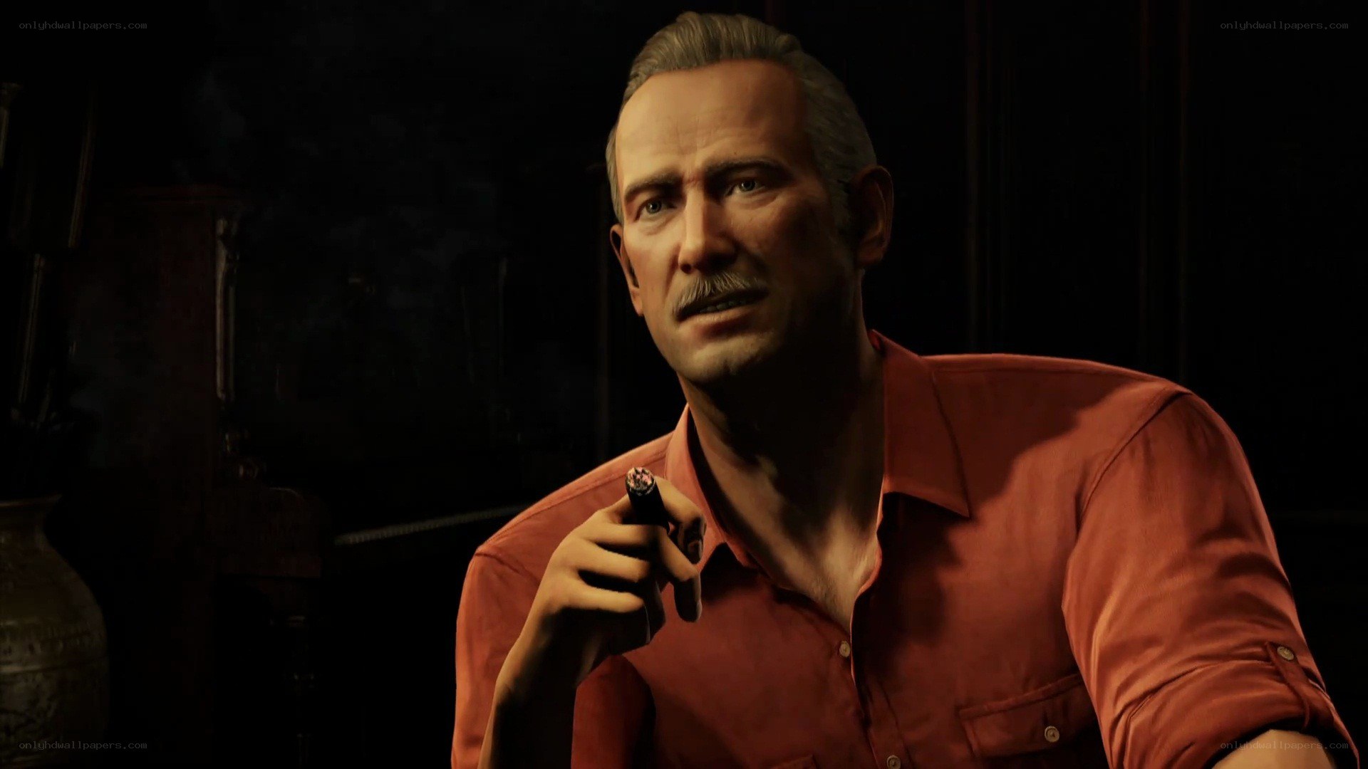 man holding cigar in dark room
