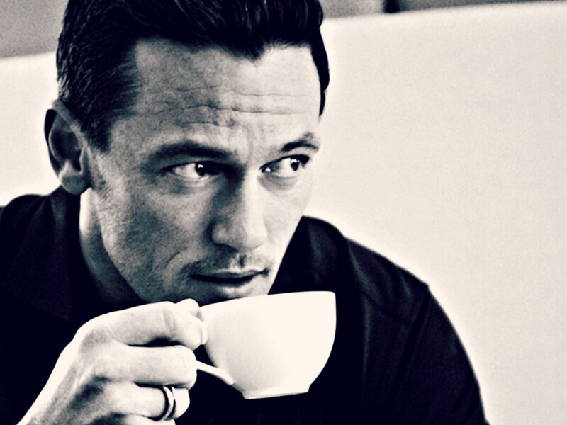 Man Holding Coffee Cup — Black, Contemplative