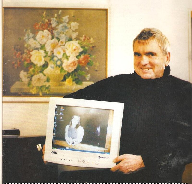 Man Holding Computer Monitor