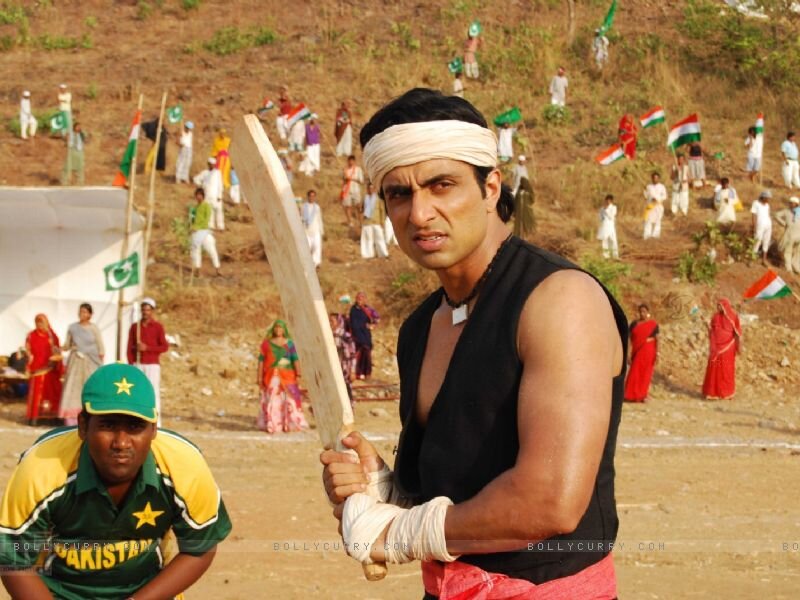 Man Holding Cricket Bat — Brown