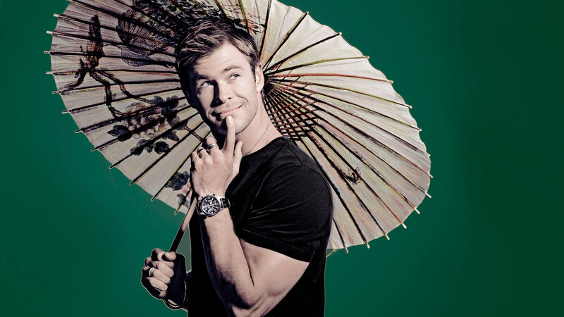 man holding decorative umbrella