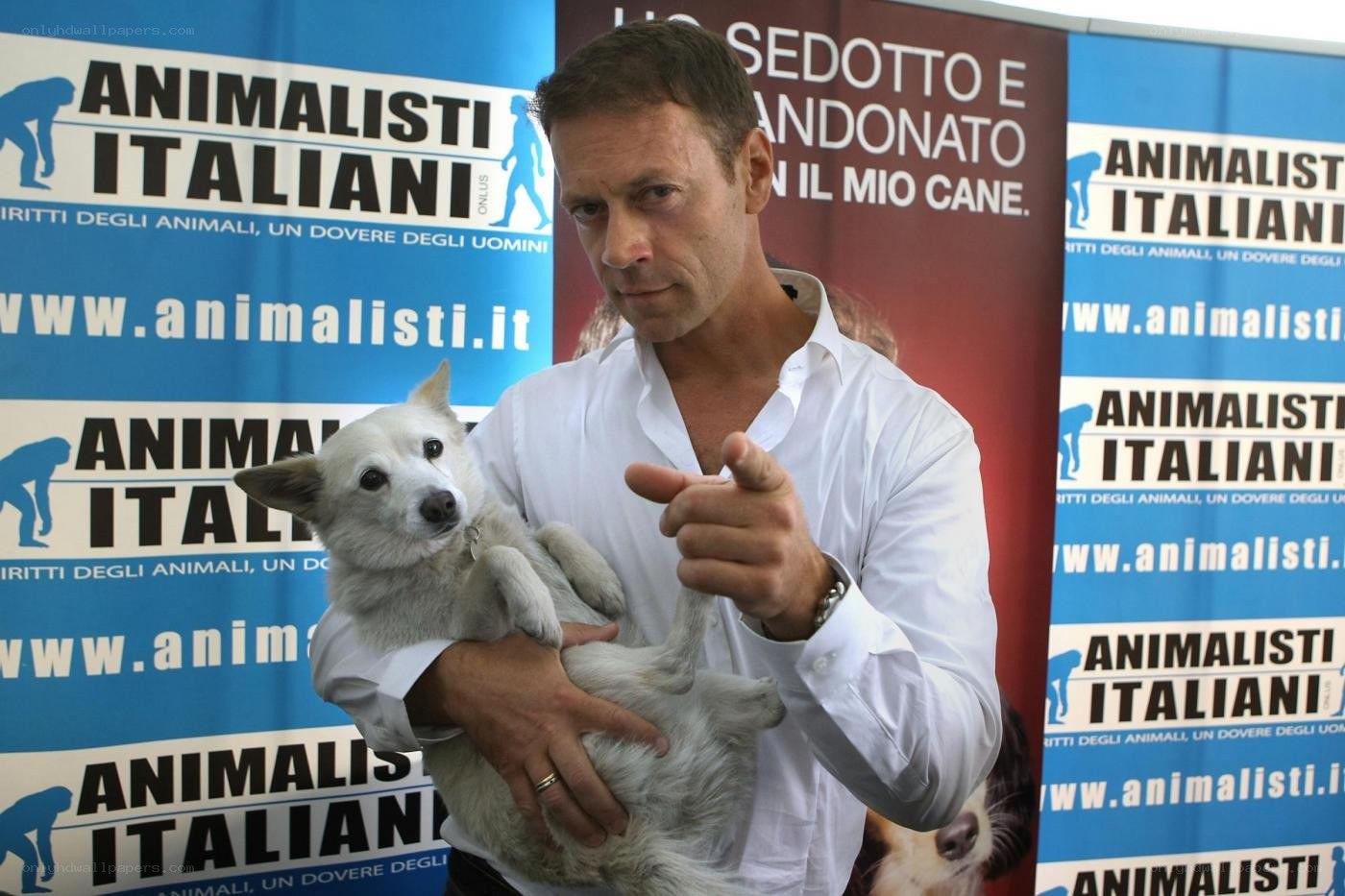 Man holding dog at event