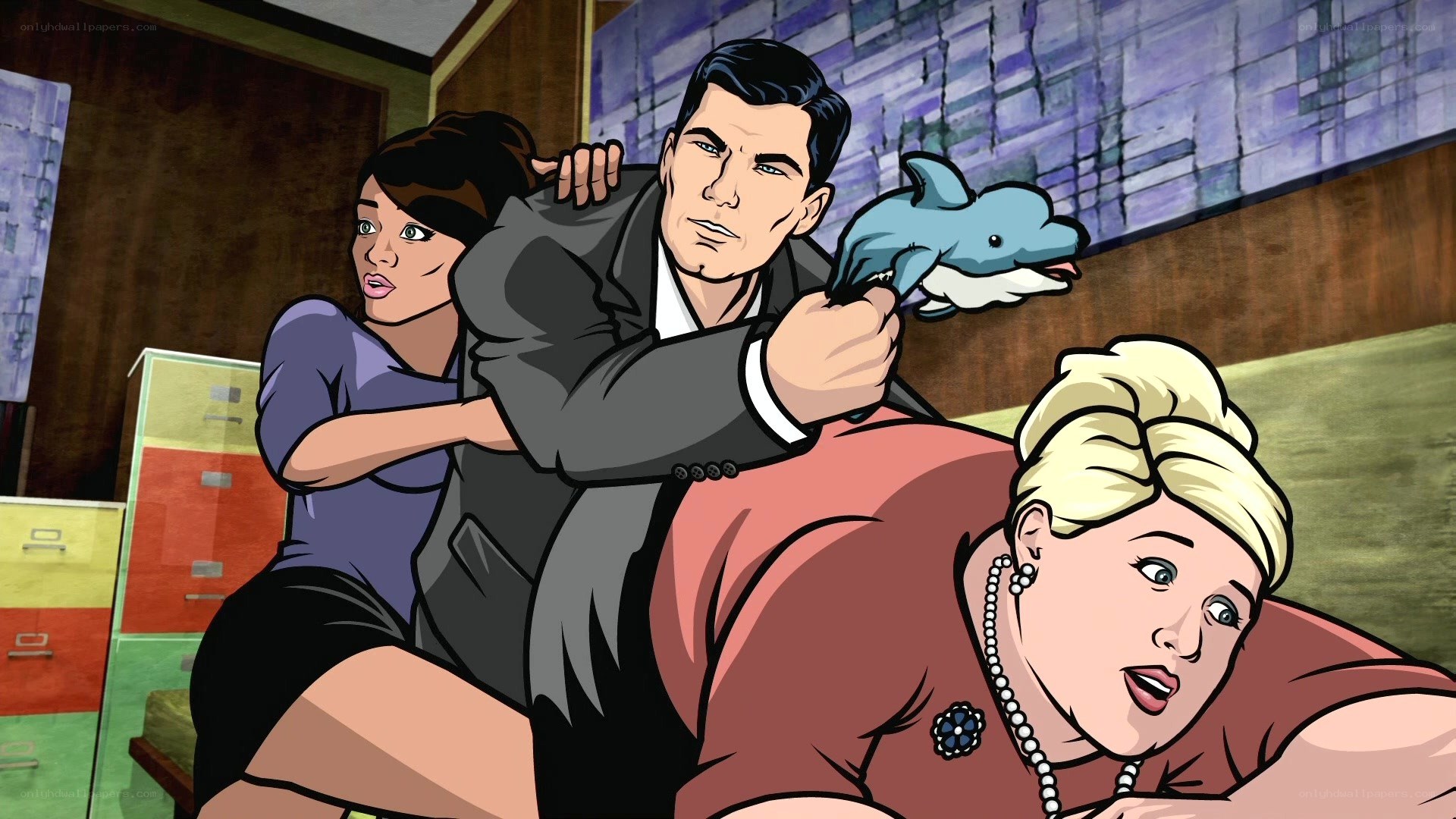 Man holding dolphin puppet in office