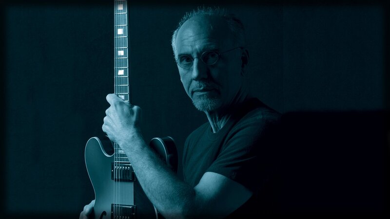 Man Holding Electric Guitar — Blue