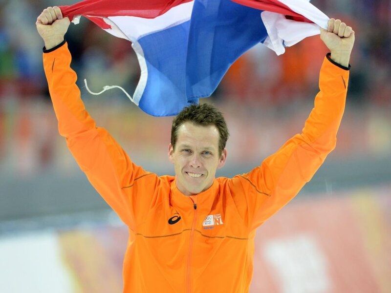 Man Holding Flag — Orange, Celebratory