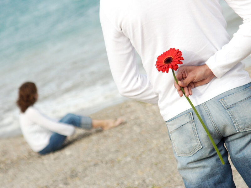 Man Holding Flower Behind Back — White