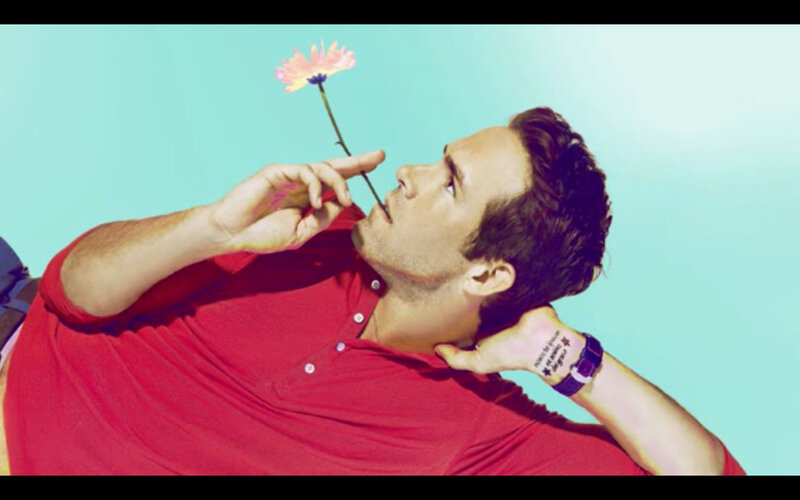 man holding flower