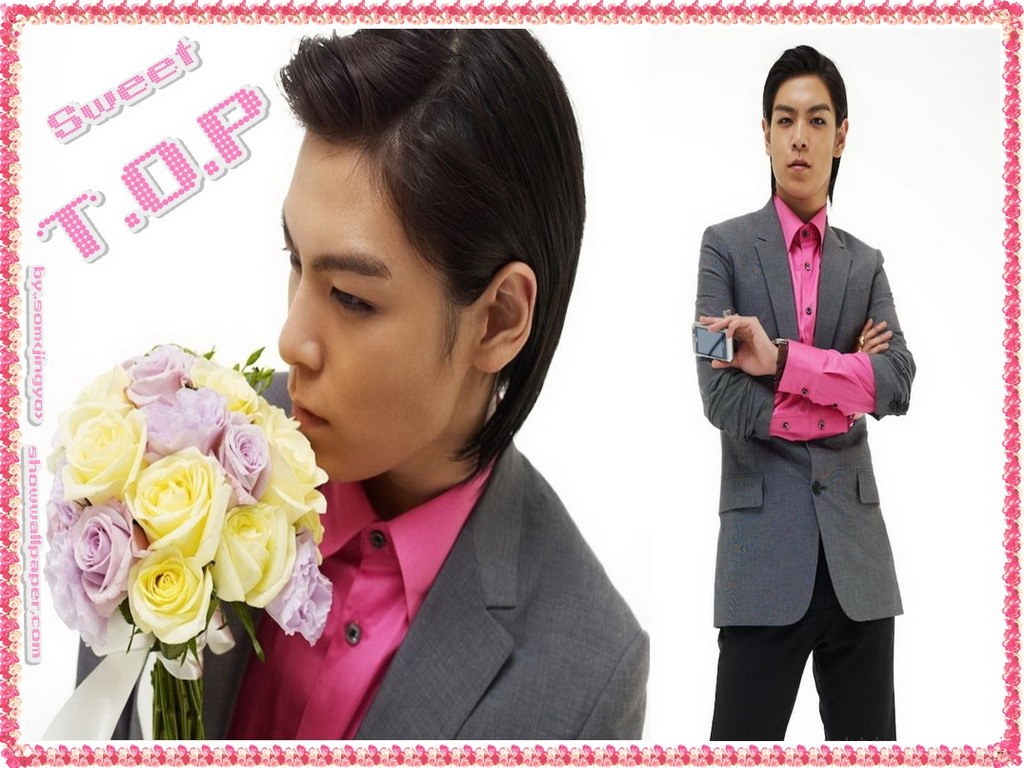 man holding flowers and phone