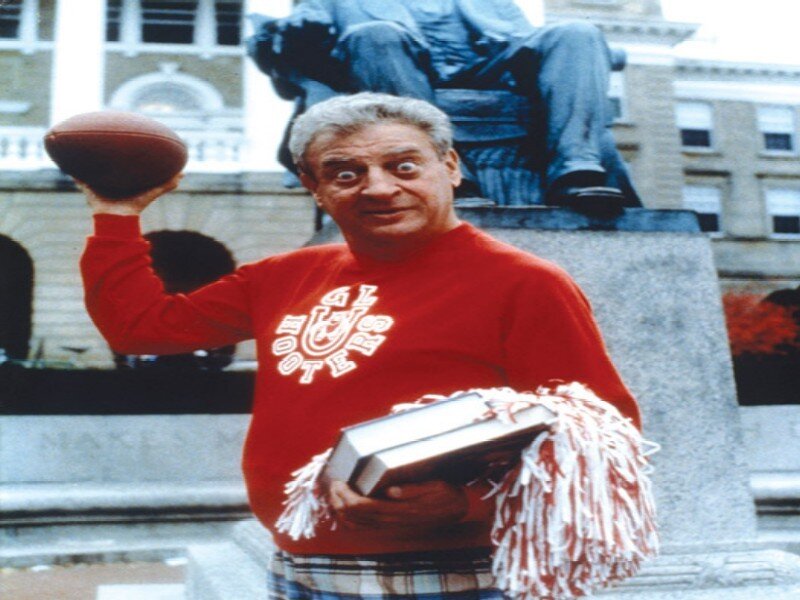 Man Holding Football — Red