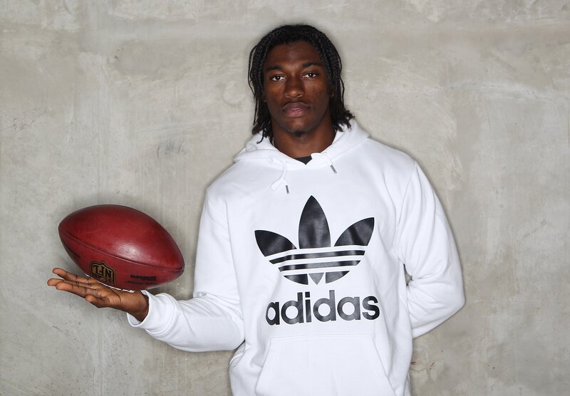 man holding football