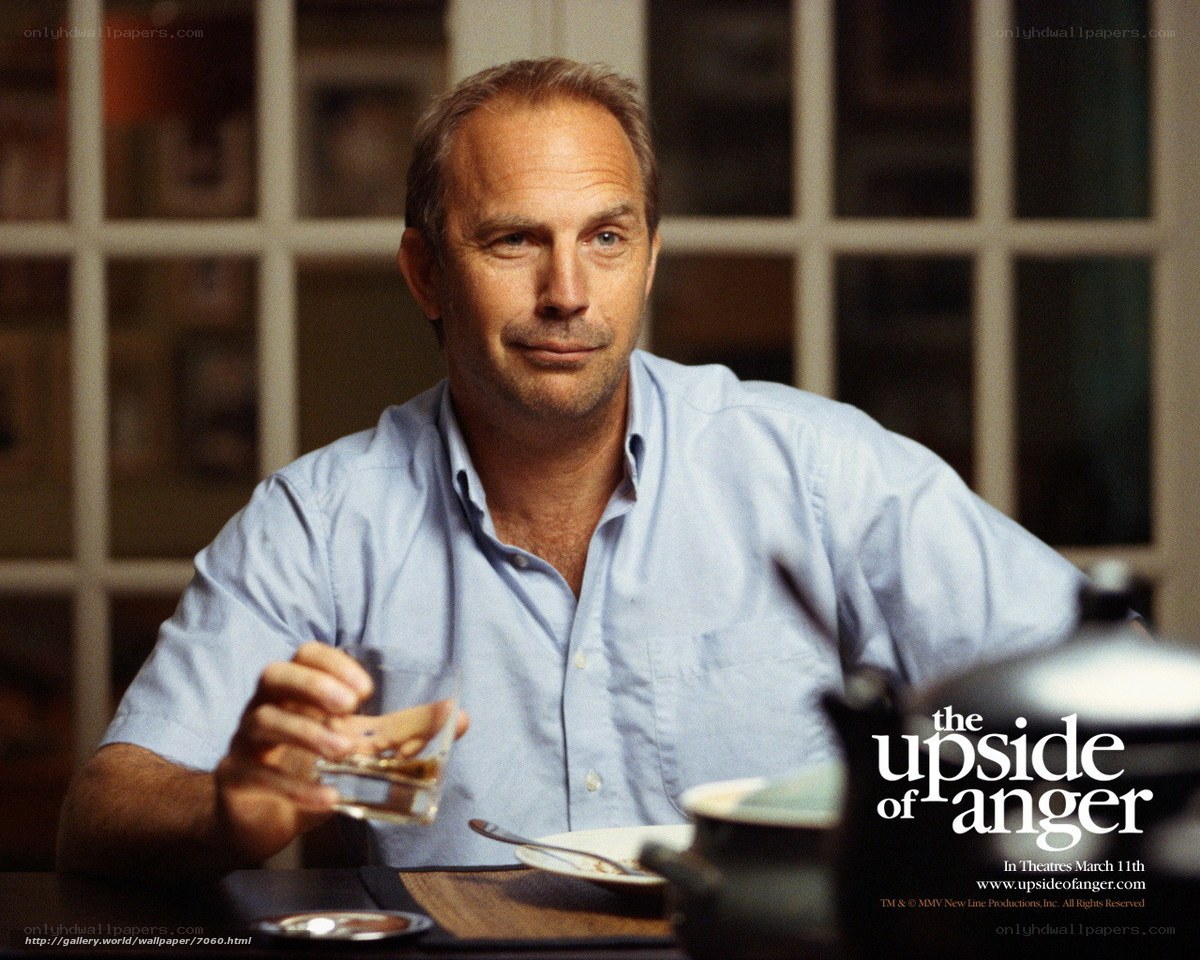 man holding glass at table