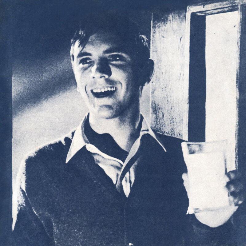 man holding glass of milk