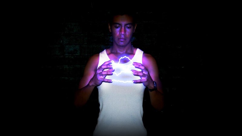 man holding glowing object