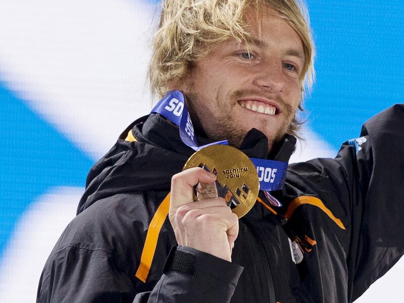 Man Holding Gold Medal