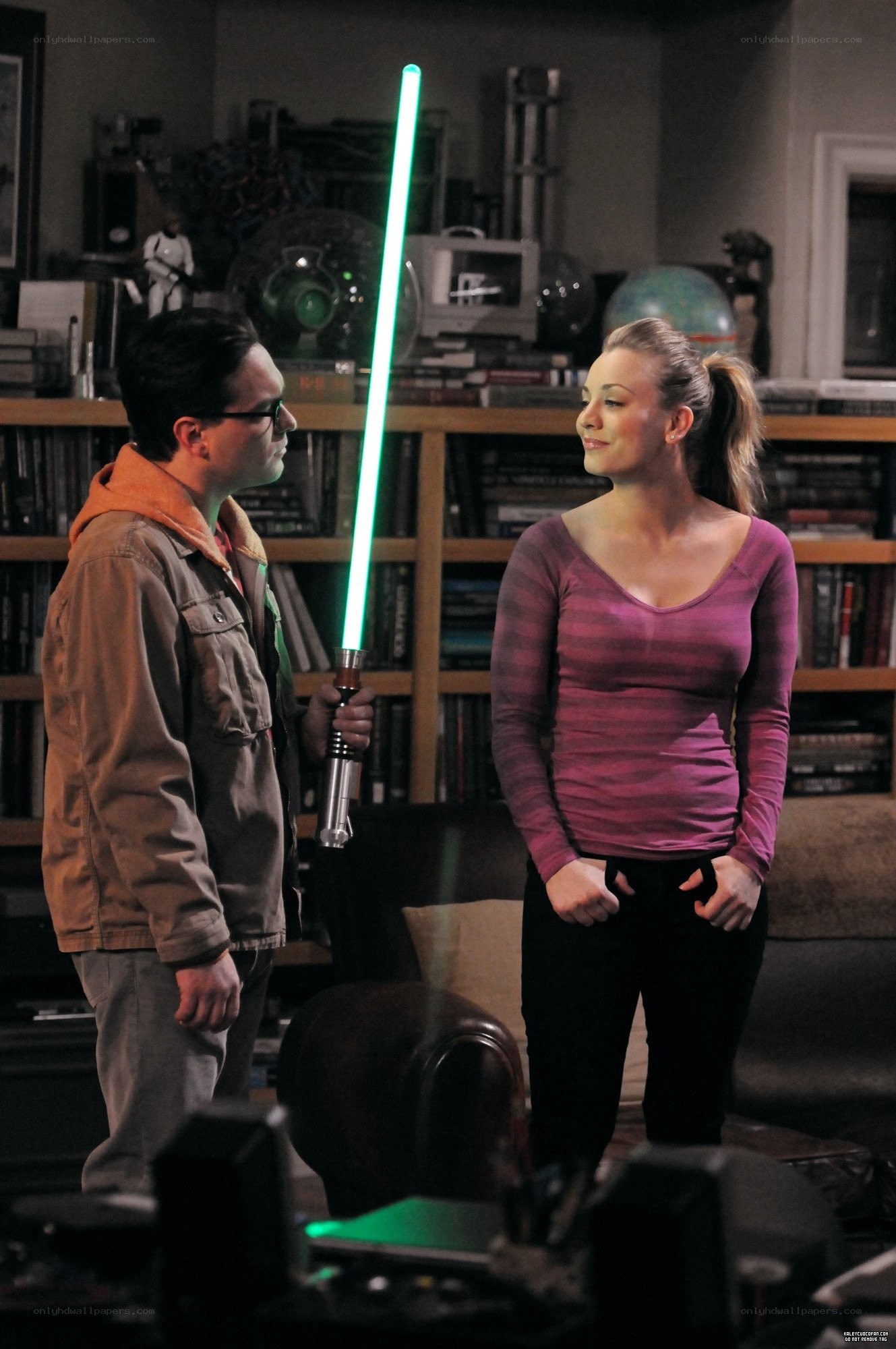 Man holding green lightsaber