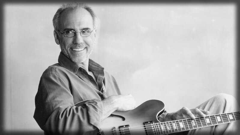 Man Holding Guitar — Black, Calm