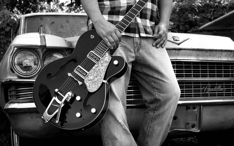 Man Holding Guitar — Black, Dramatic, Photograph, Car