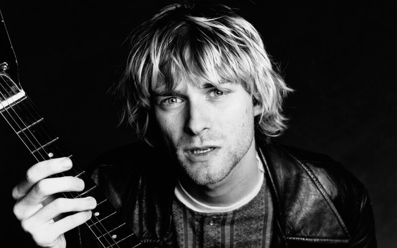 Man Holding Guitar — Black, Dramatic, Photograph, Leather Jacket