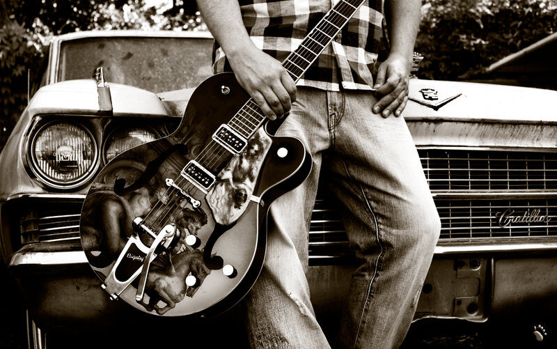 Man Holding Guitar — Black, Dramatic, Photograph