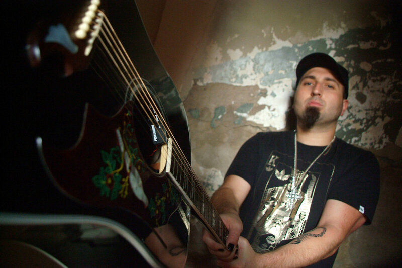 Man Holding Guitar — Black, Dramatic