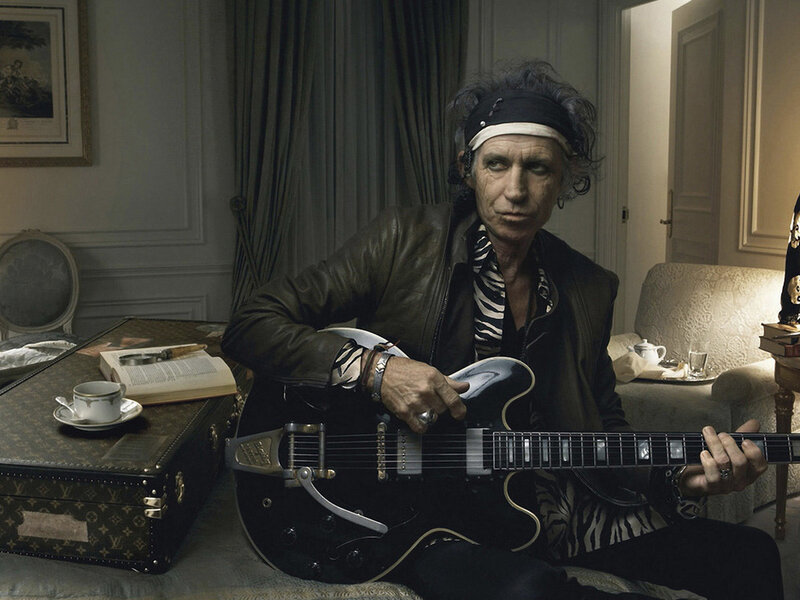 Man Holding Guitar — Black, Serious