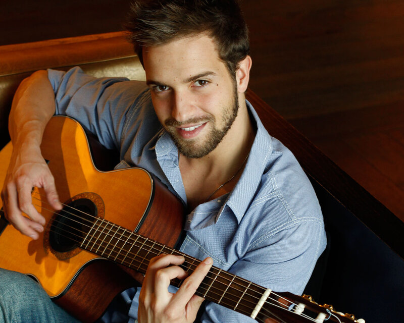 Man Holding Guitar — Brown, Relaxed